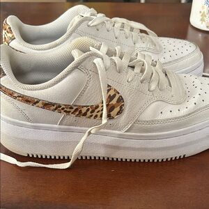 Nike Cream Sneakers with Leopard Print Swoosh. Court vision Alta, has a platform